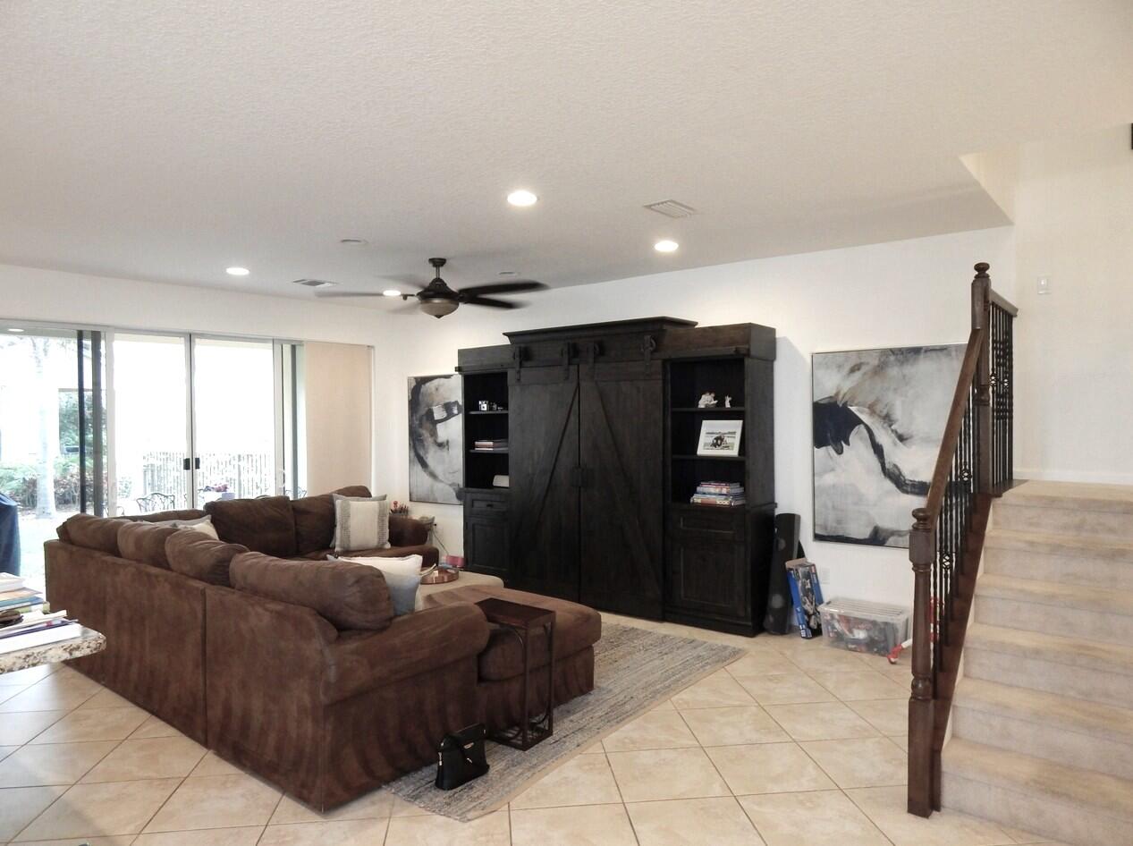 4820 Northwest 16th Terrace Boca Raton, FL 33431 - Photo 6 of 39 a living room with furniture and a flat screen tv