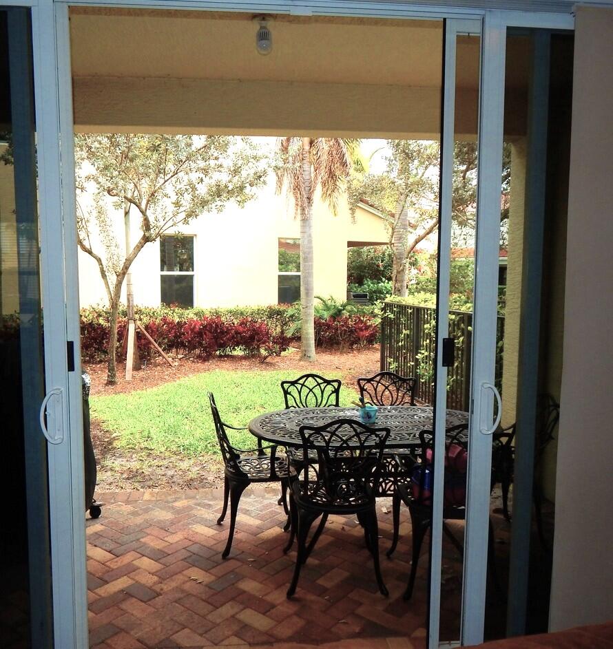 4820 Northwest 16th Terrace Boca Raton, FL 33431 - Photo 9 of 39 a view of a patio with table and chairs