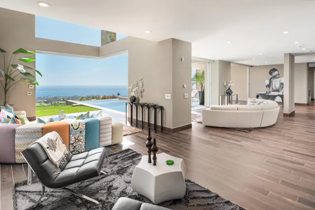 a kitchen with a sink a stove and cabinets