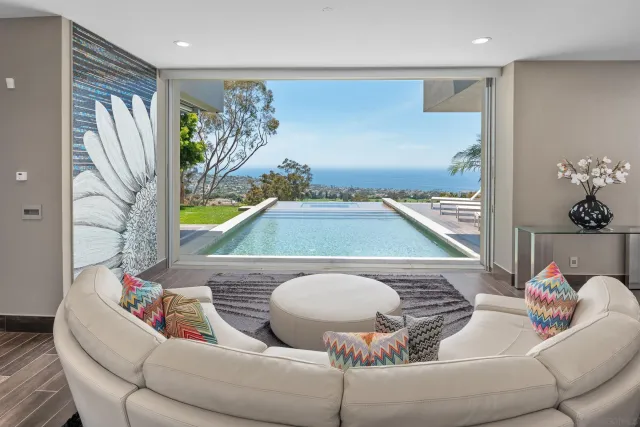 a living room with furniture and a breakfast area