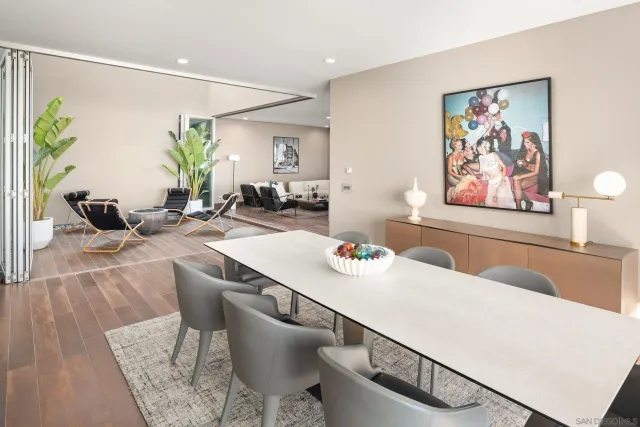 a view of a terrace with couches and lounge chairs