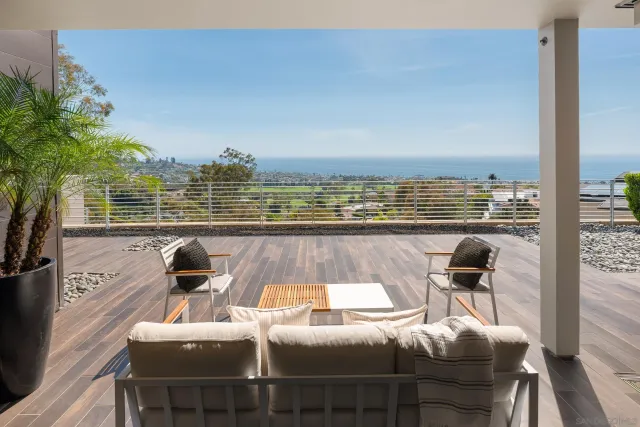 a bathroom with a granite countertop sink a toilet and bathtub