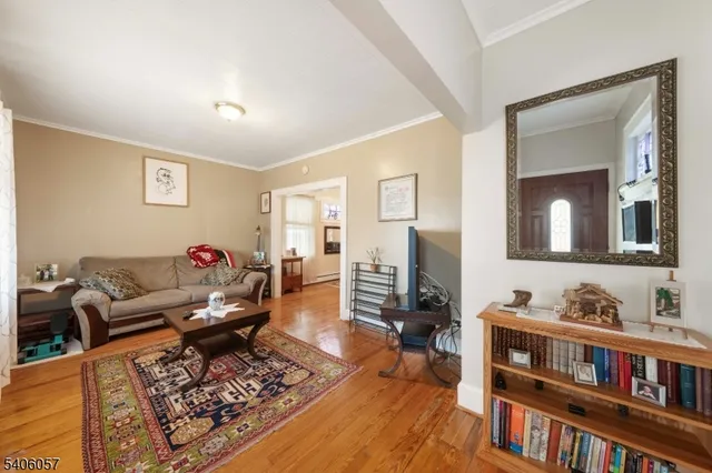 a living room with furniture and a book shelf