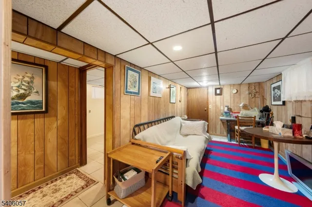 a livingroom with furniture and a dining table