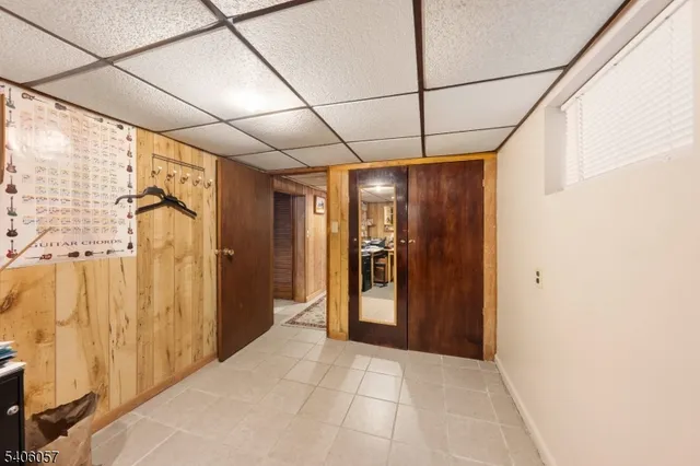 a view of hallway with a bathroom