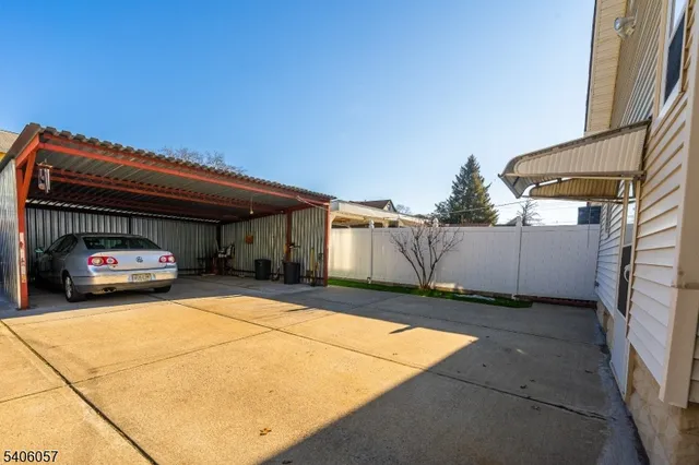 a view of a car park in front of house
