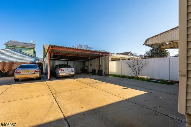 a view of a car park in front of house