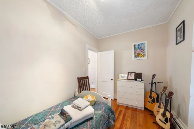 a view of a workspace with furniture and wooden floor