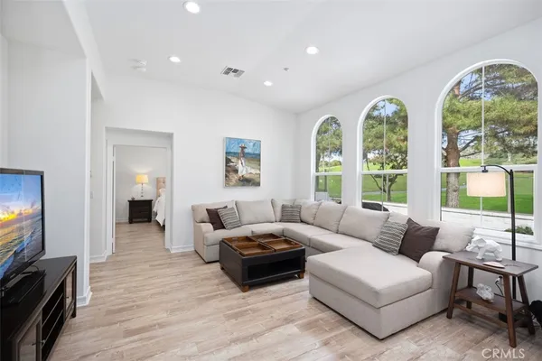 a living room with furniture and a large window