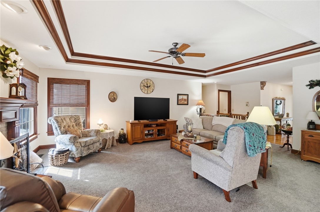 5300 Brookshire Lane Springfield, OH 45502 - Photo 11 of 56 This living room features a tray ceiling with decorative wood accents, perfect for relaxing.