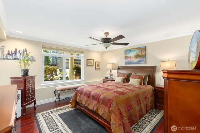 a bedroom with a bed and a dresser in it