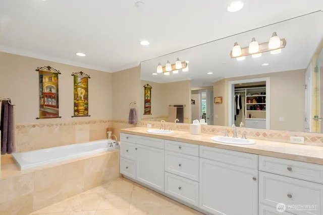 a bathroom with a double vanity sink and a mirror