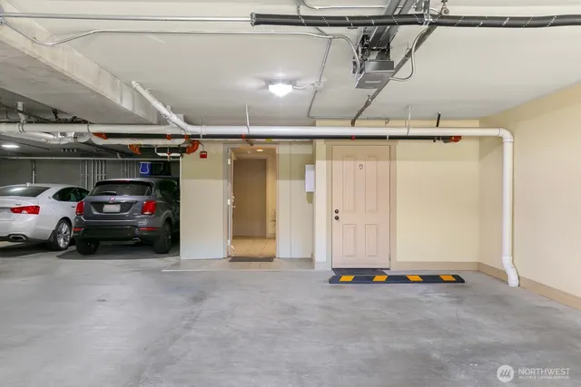 a view of a patio with chairs and potted plants