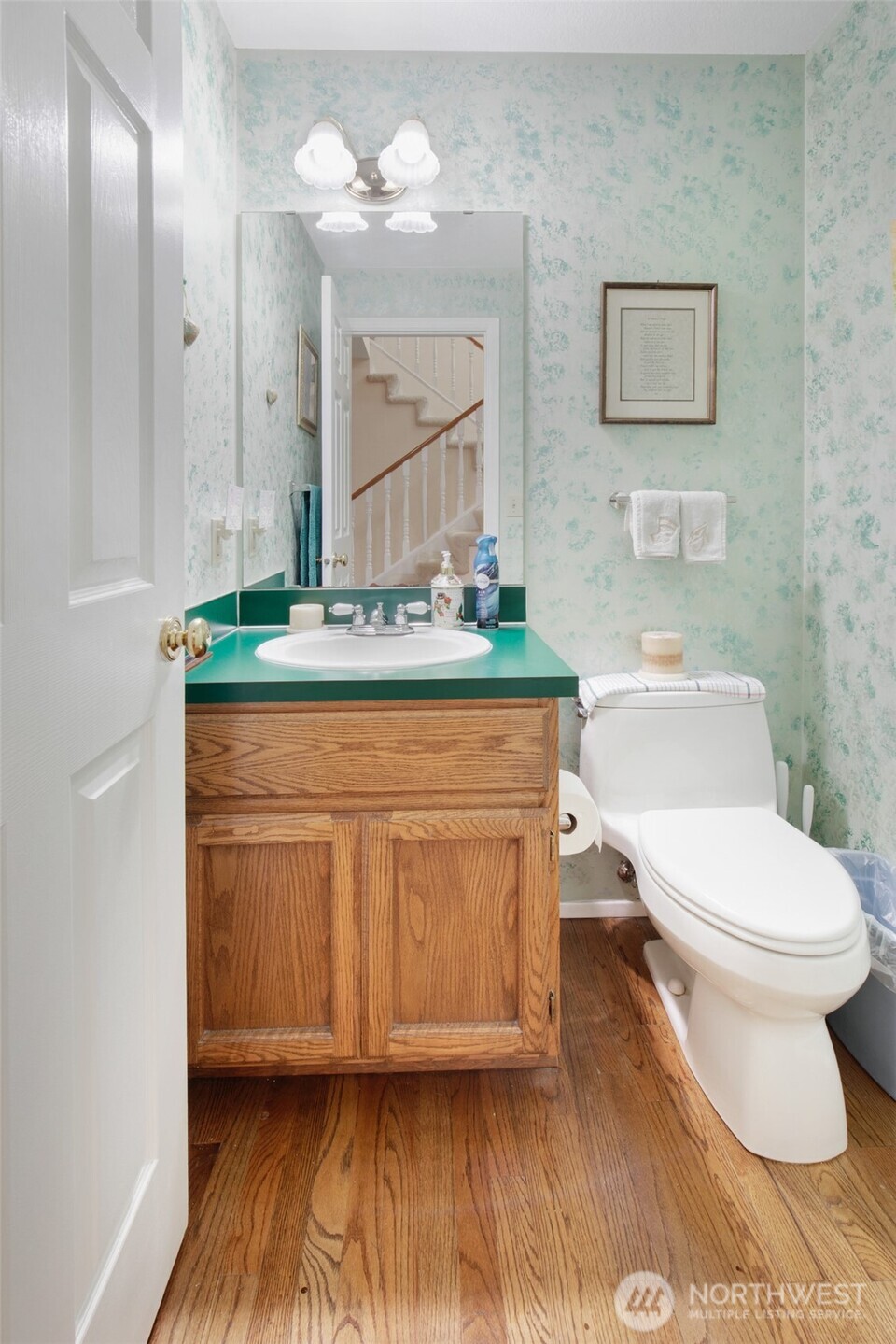 11908 Northeast 168th Street Bothell, WA 98011 - Photo 11 of 30 a bathroom with a toilet a sink and mirror