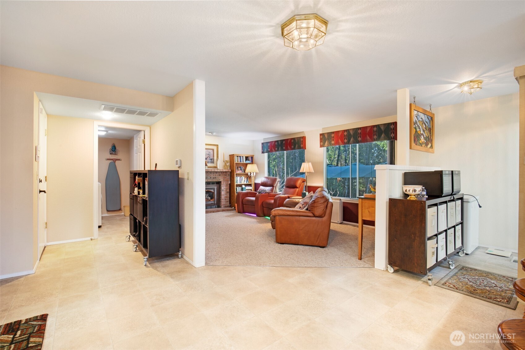 11908 Northeast 168th Street Bothell, WA 98011 - Photo 12 of 30 a view of a livingroom with furniture and a kitchen