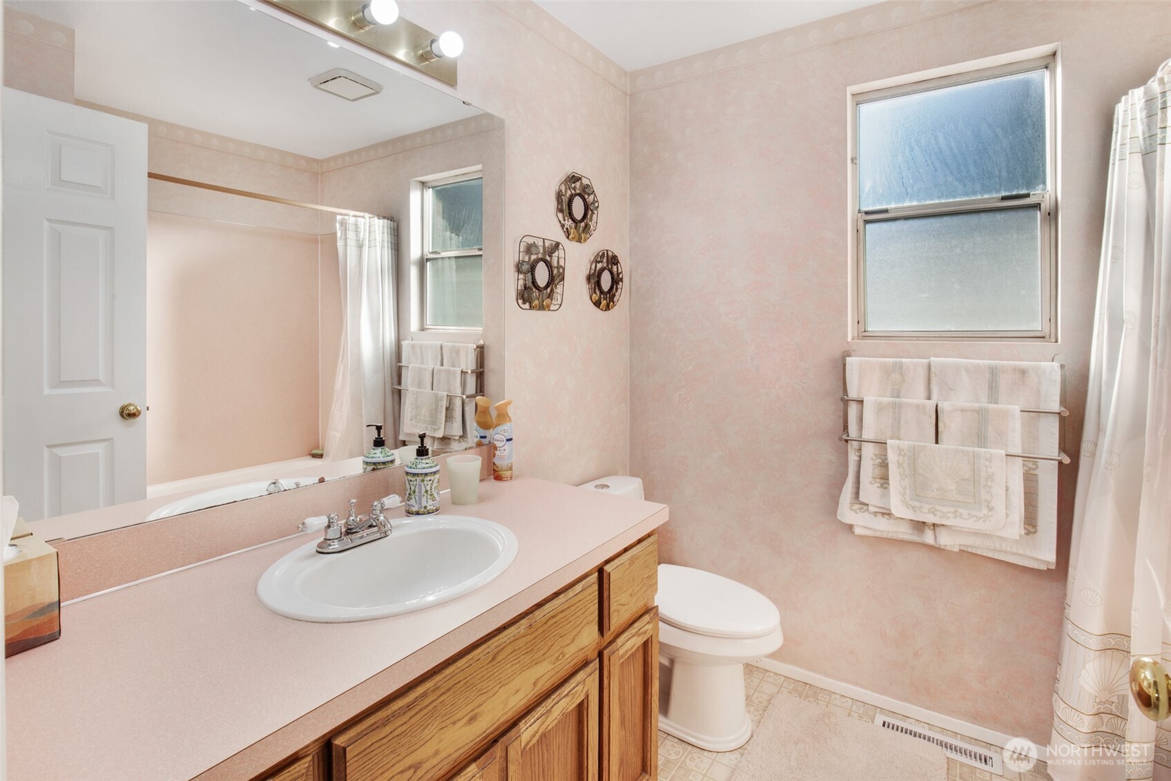 11908 Northeast 168th Street Bothell, WA 98011 - Photo 14 of 30 a bathroom with a sink toilet and shower