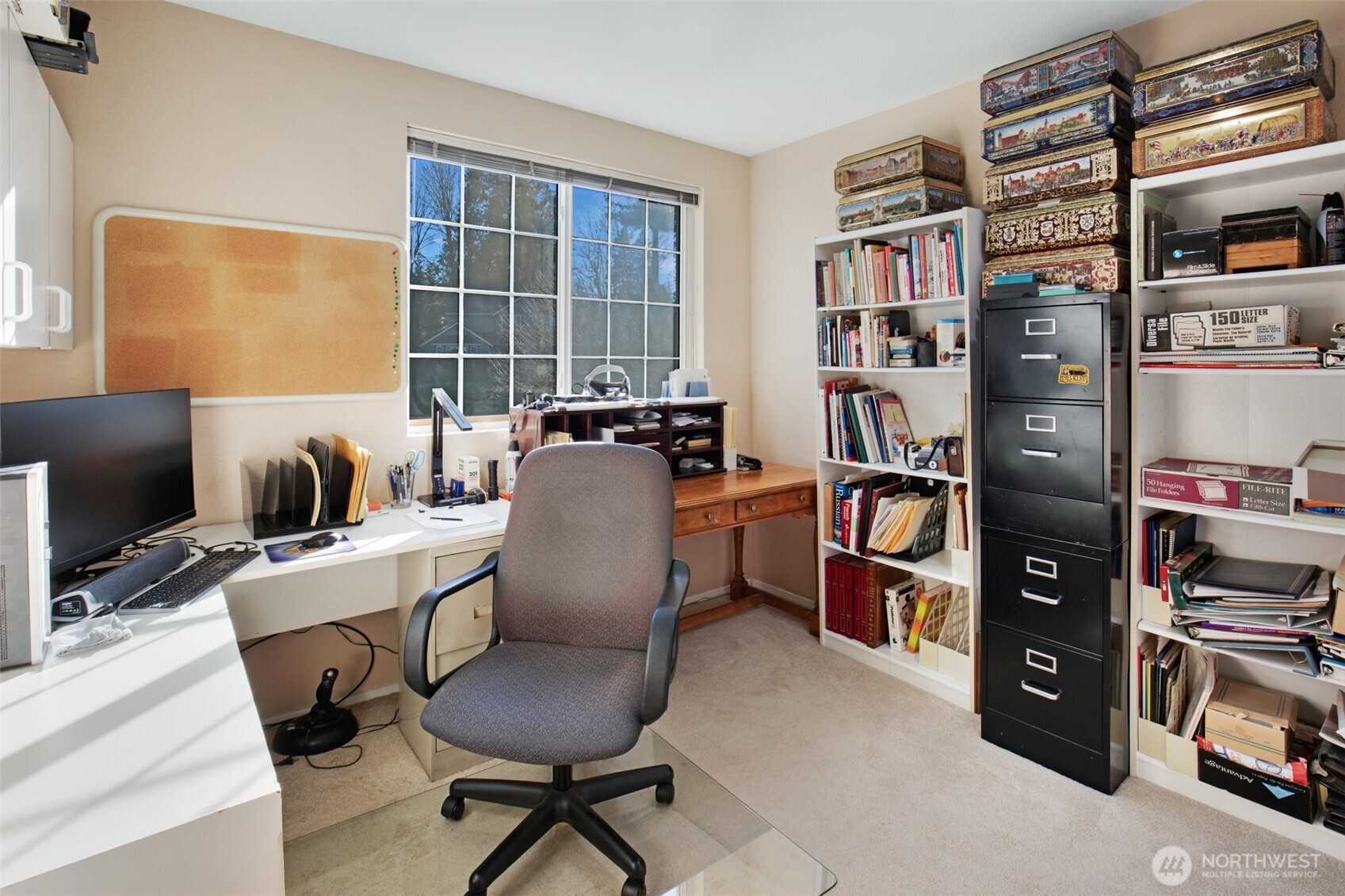 11908 Northeast 168th Street Bothell, WA 98011 - Photo 15 of 30 a view of a workspace with furniture and a bookshelf