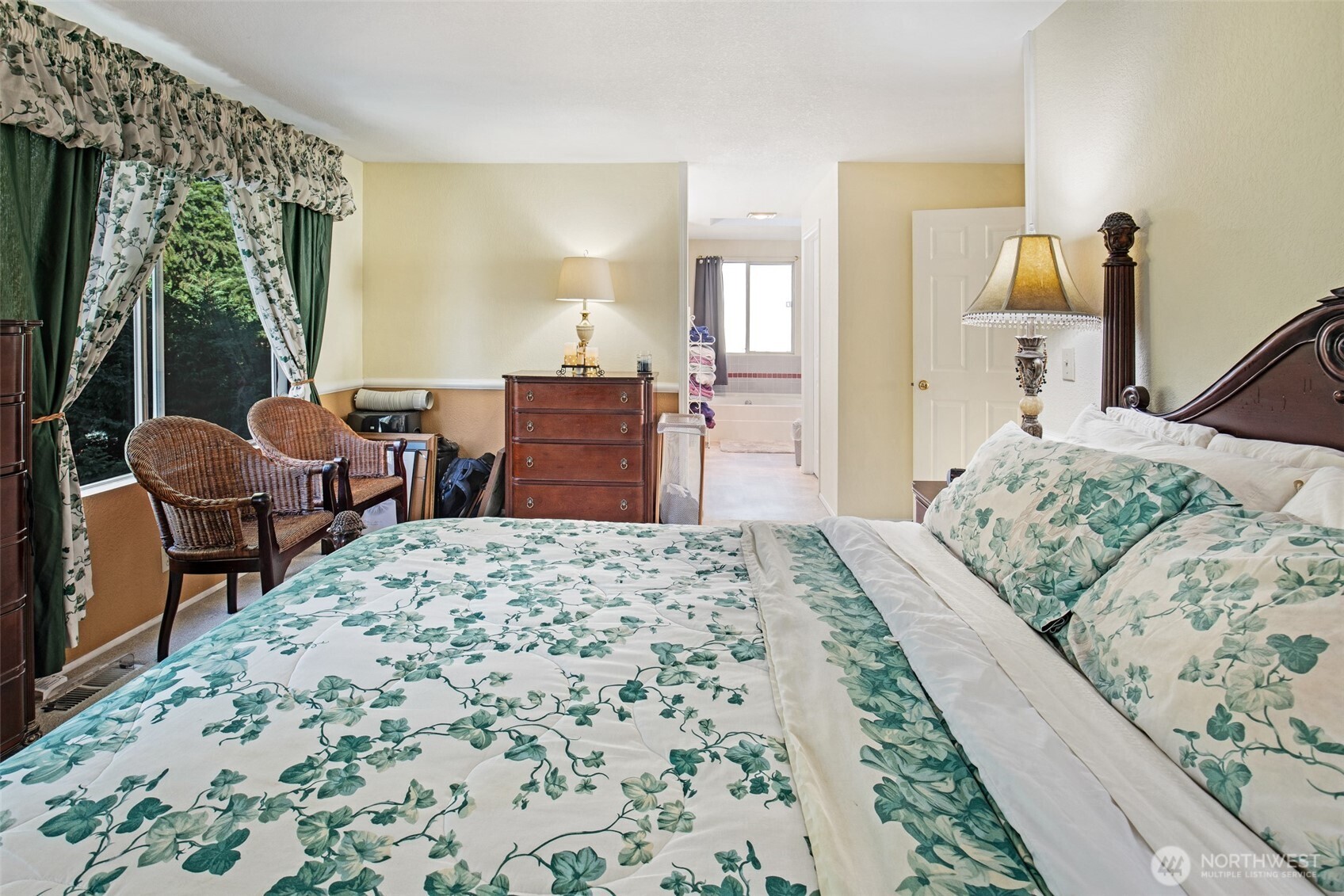 11908 Northeast 168th Street Bothell, WA 98011 - Photo 17 of 30 a bedroom with a bed and wooden floor