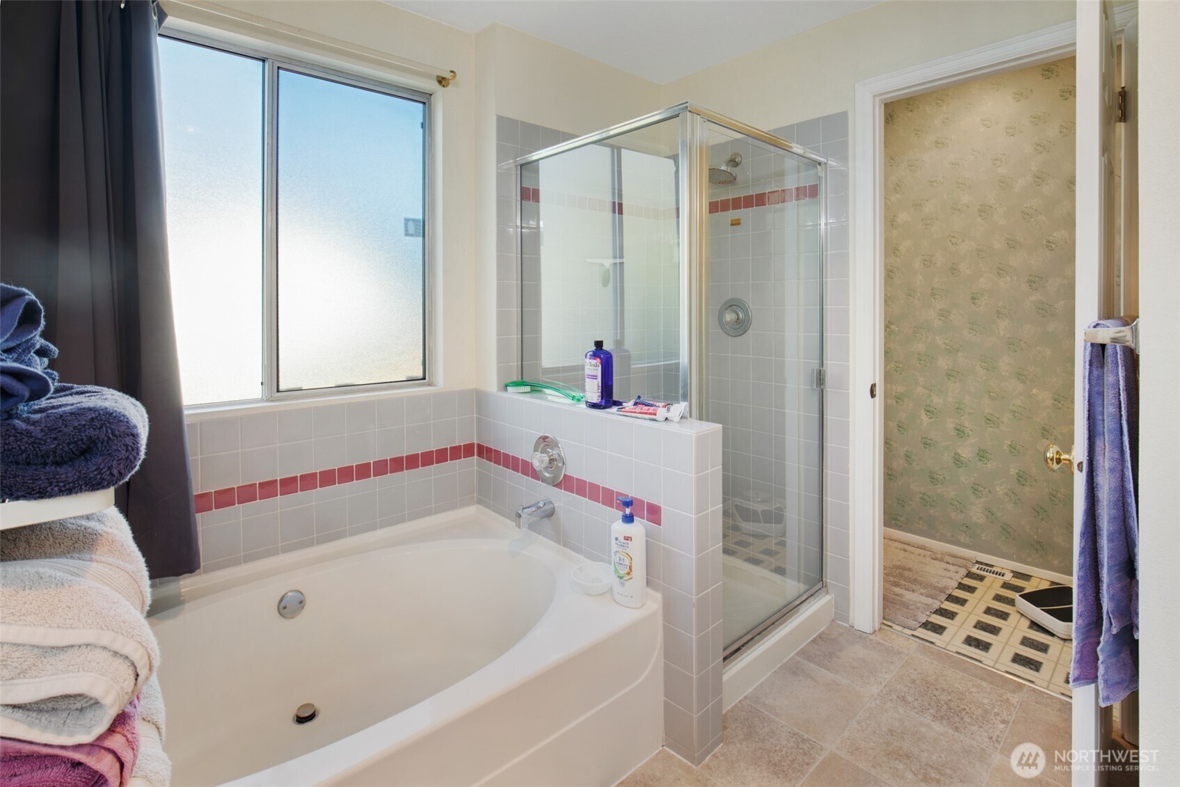 11908 Northeast 168th Street Bothell, WA 98011 - Photo 19 of 30 a bathroom with a bathtub and a shower