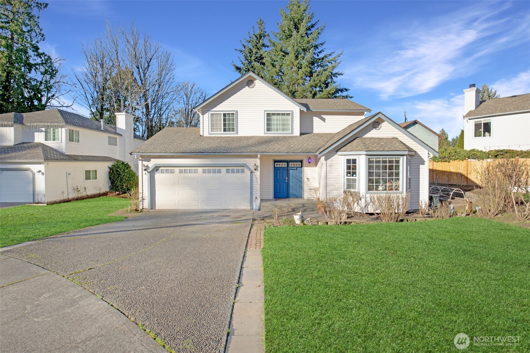 11908 Northeast 168th Street Bothell, WA 98011 - Photo 2 of 30 a front view of a house with a garden and yard