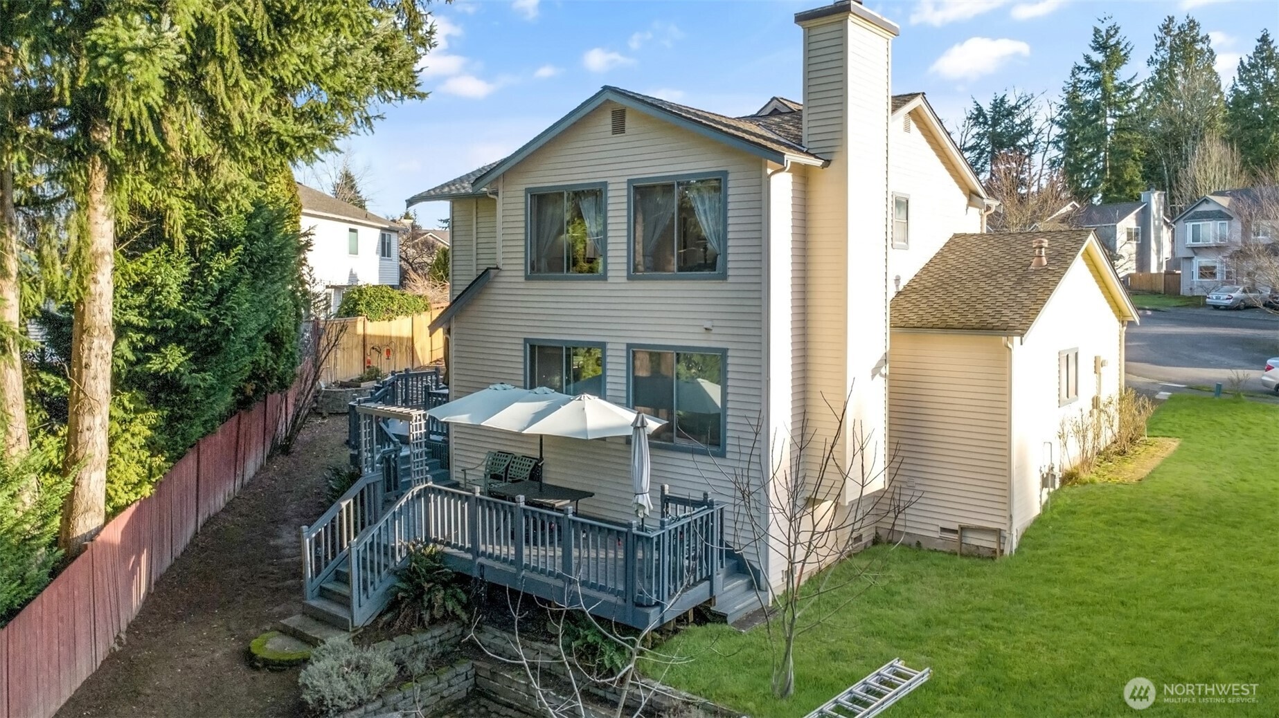 11908 Northeast 168th Street Bothell, WA 98011 - Photo 27 of 30 a front view of a house with yard and seating area