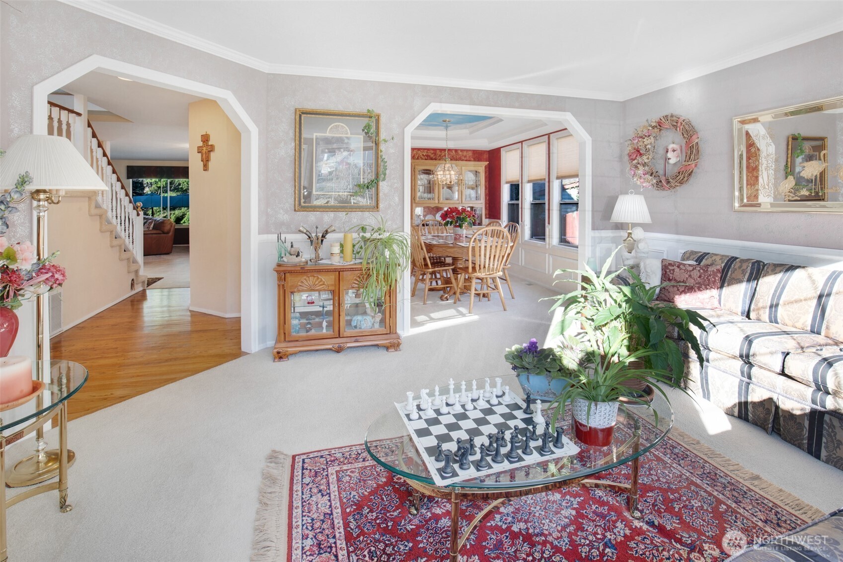 11908 Northeast 168th Street Bothell, WA 98011 - Photo 5 of 30 a living room filled with furniture and flowers