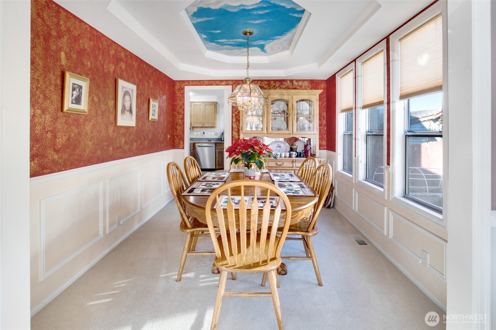 11908 Northeast 168th Street Bothell, WA 98011 - Photo 6 of 30 a dining room with furniture a chandelier and wooden floor
