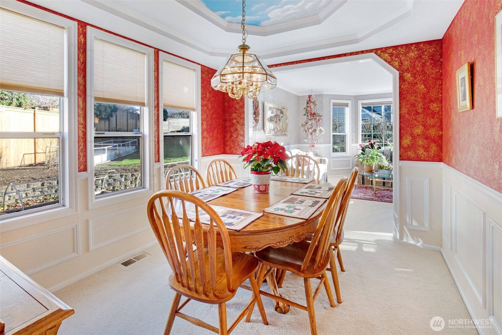 11908 Northeast 168th Street Bothell, WA 98011 - Photo 7 of 30 a dining room with furniture a chandelier and window
