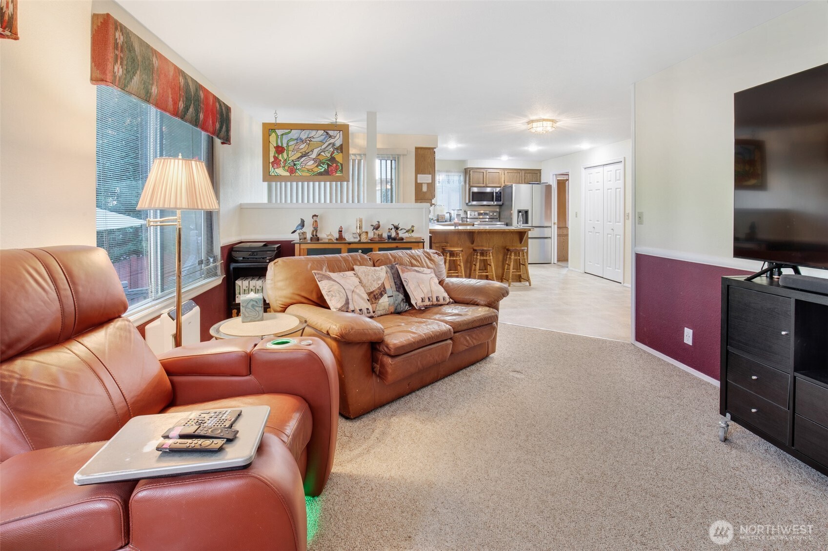 11908 Northeast 168th Street Bothell, WA 98011 - Photo 9 of 30 a living room with furniture and a flat screen tv