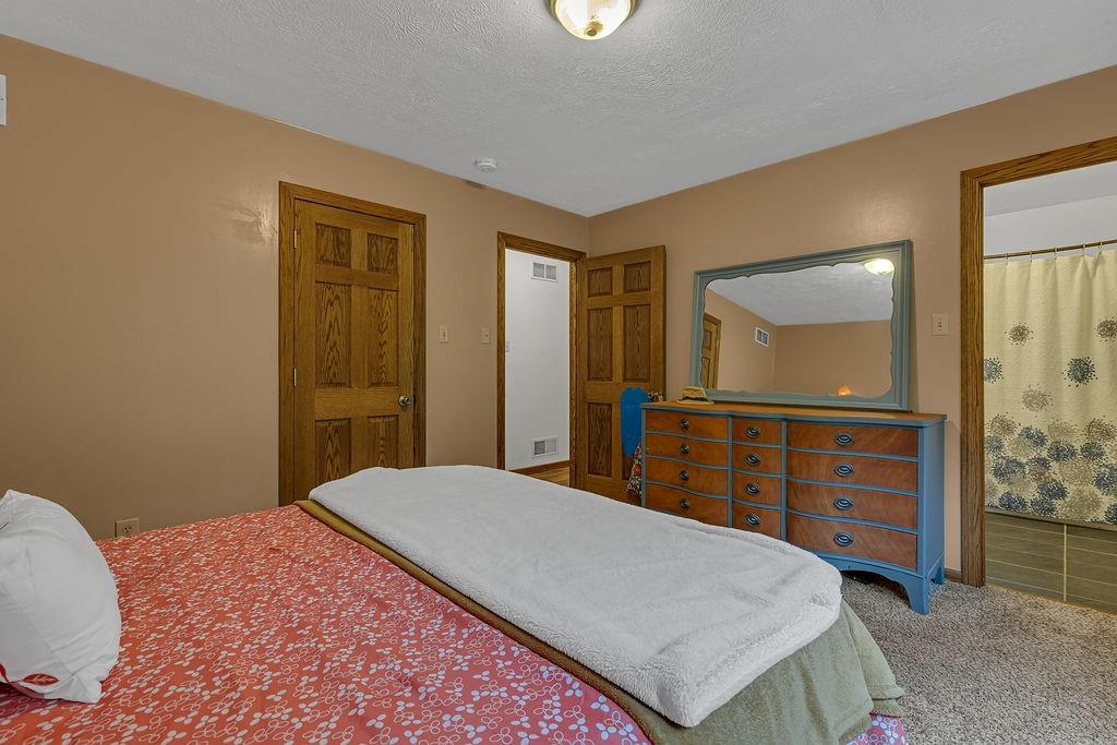 6014 Forest Drive Monaca, PA 15061 - Photo 15 of 32 a bedroom with a bed and a dresser