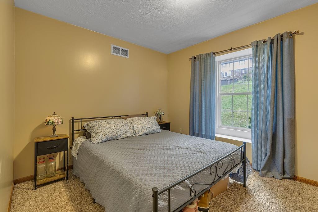 6014 Forest Drive Monaca, PA 15061 - Photo 20 of 32 a bedroom with a bed and a window