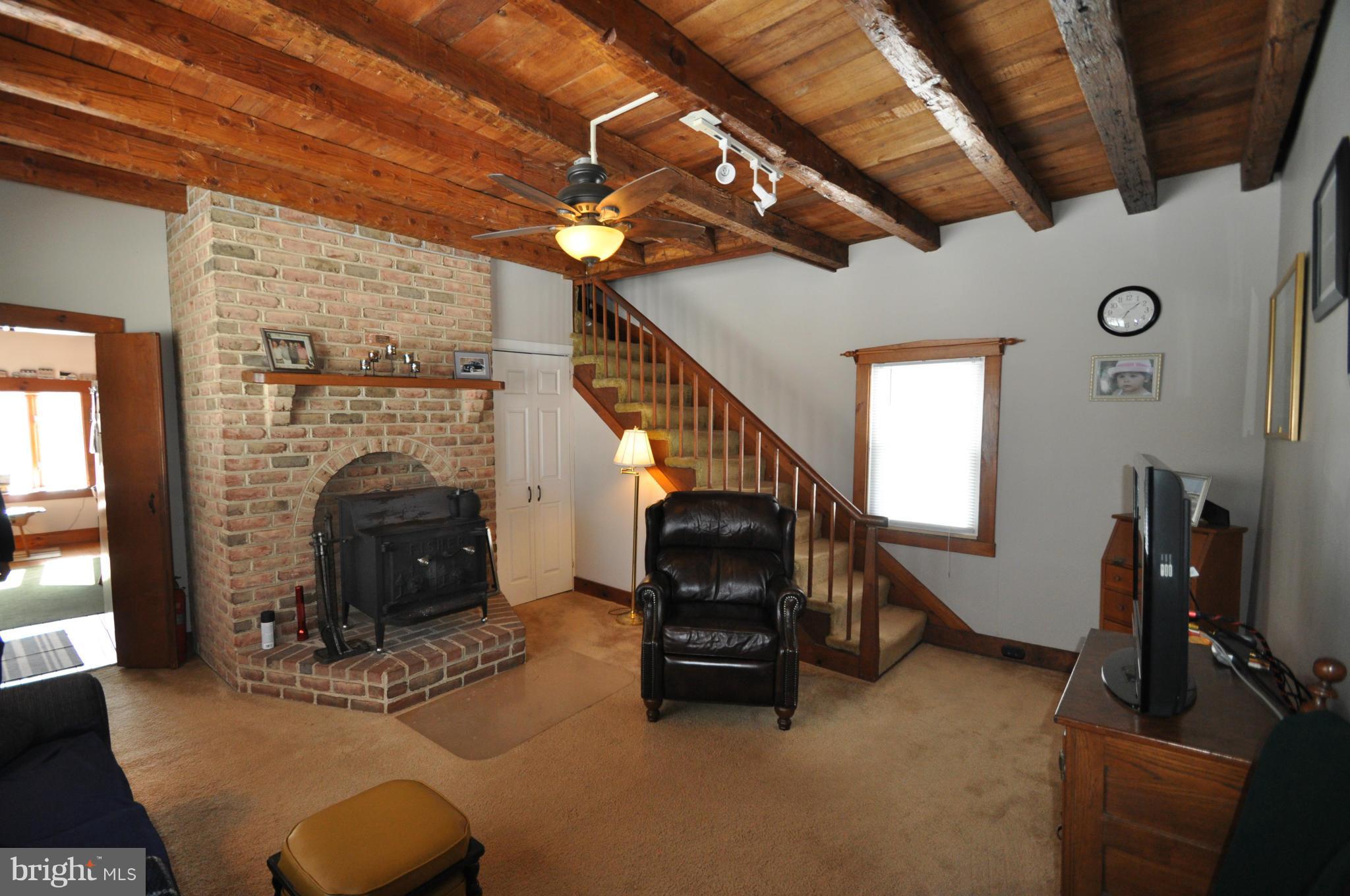 3242 Sykesville Road Westminster, MD 21157 - Photo 6 of 18 EXPOSED BEAMS, LARGE WOOD STOVE SO MUCH CHARM