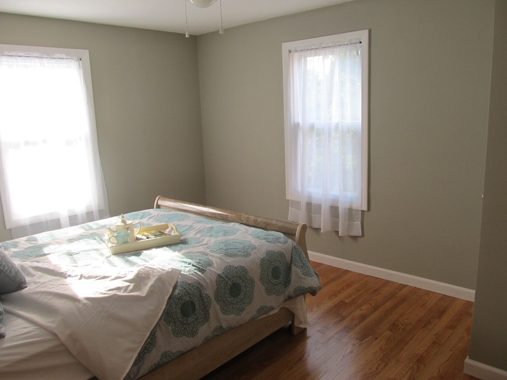 67 Clough Street Springfield, MA 01118 - Photo 12 of 22 a bedroom with a bed and a window