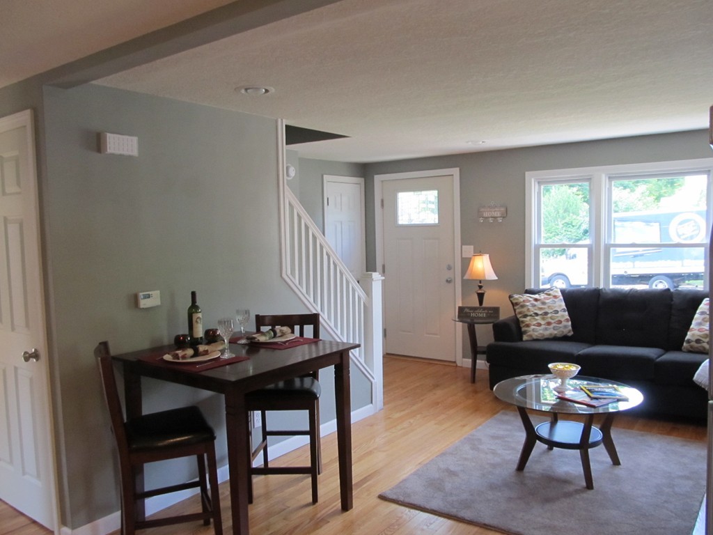 67 Clough Street Springfield, MA 01118 - Photo 8 of 22 a living room with furniture a window and a table