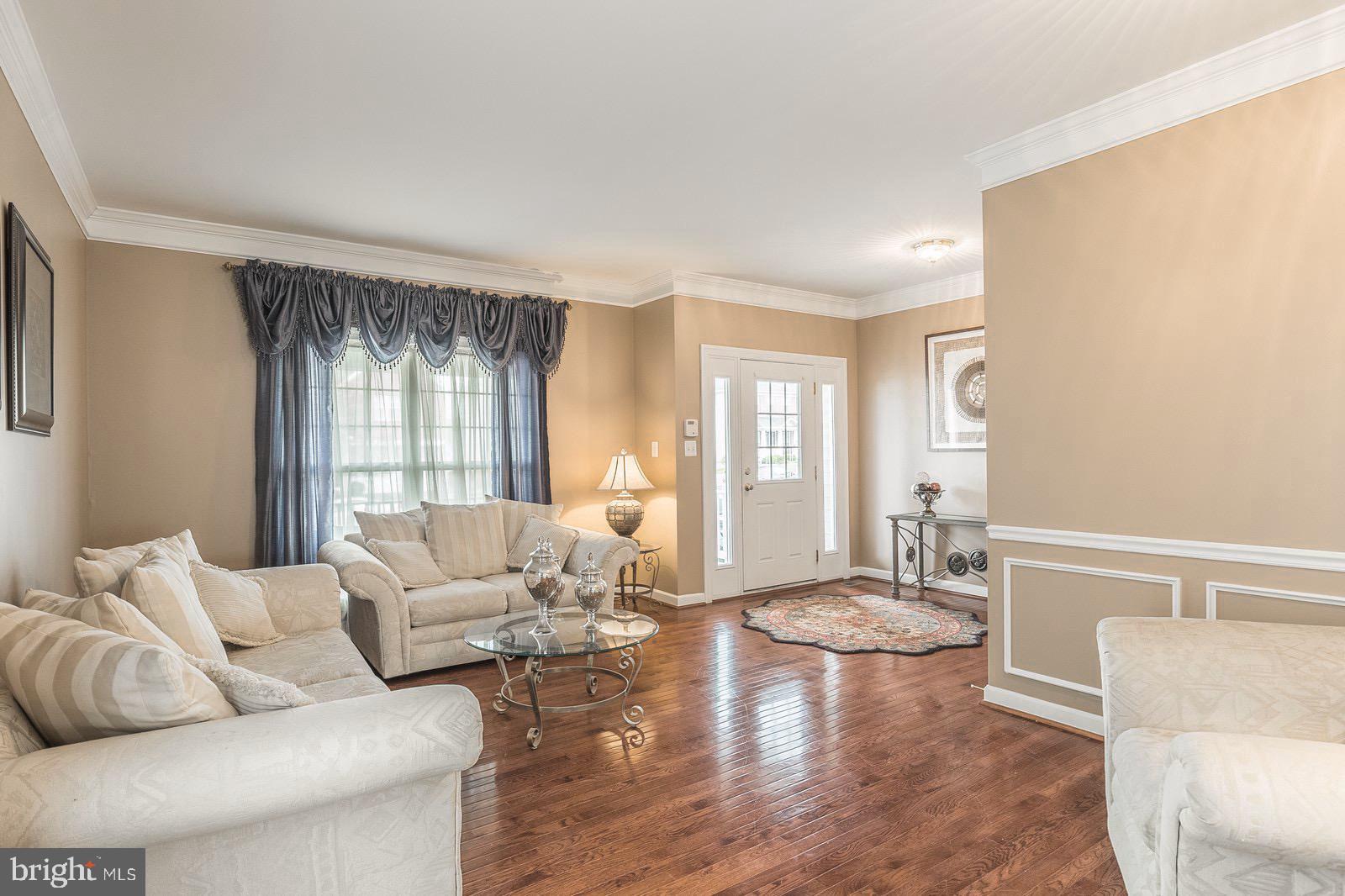 4157 Agency Loop Triangle, VA 22172 - Photo 11 of 30 a living room with furniture and a large window