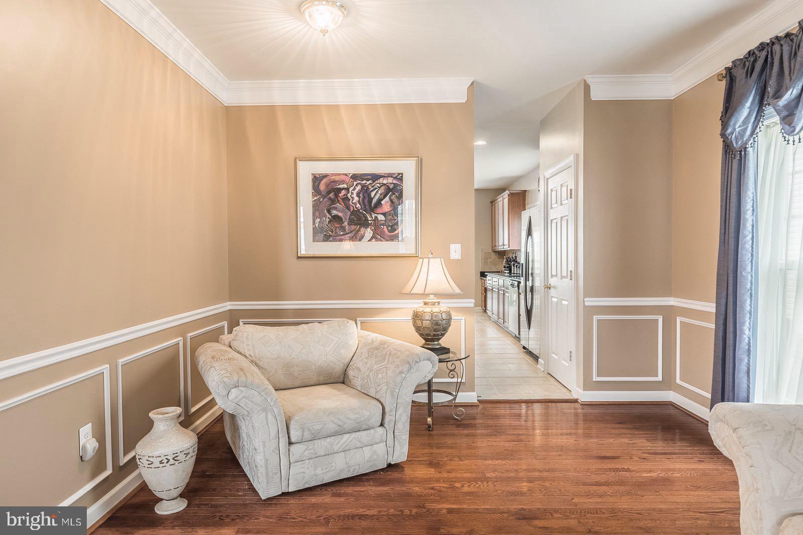 4157 Agency Loop Triangle, VA 22172 - Photo 12 of 30 a living room with furniture and a wooden floor
