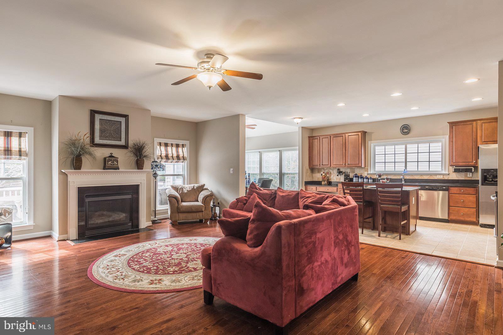 4157 Agency Loop Triangle, VA 22172 - Photo 13 of 30 a living room with furniture a fireplace and a flat screen tv