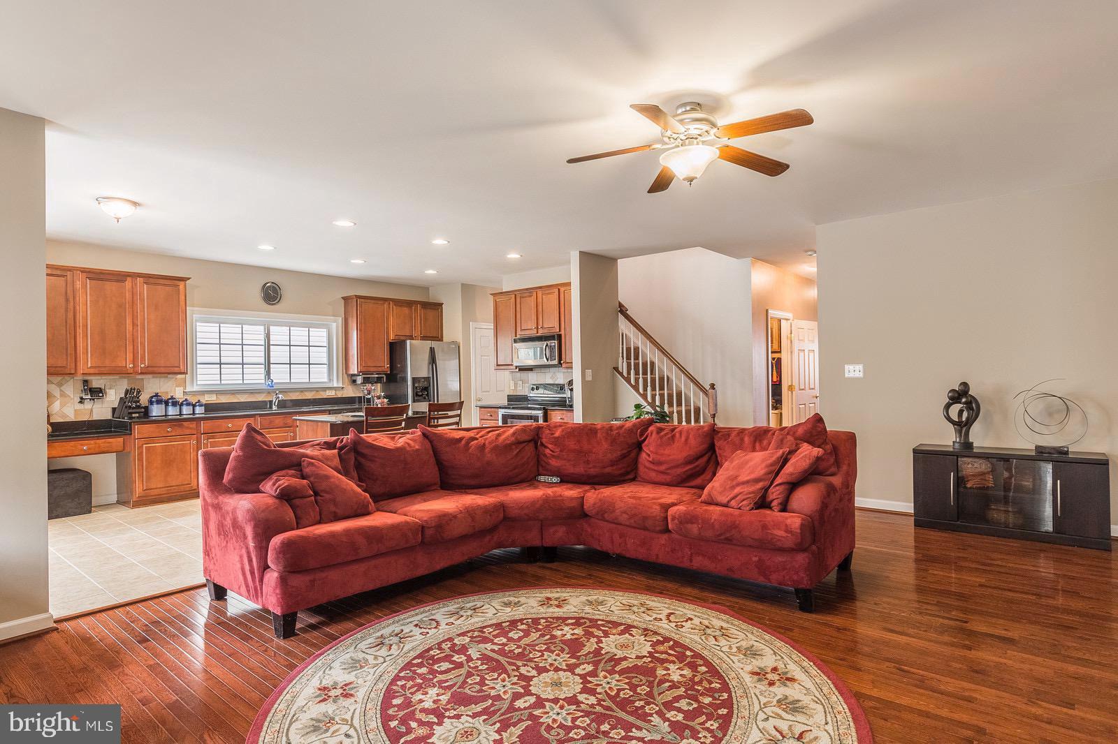 4157 Agency Loop Triangle, VA 22172 - Photo 30 of 30 a living room with furniture and a wooden floor