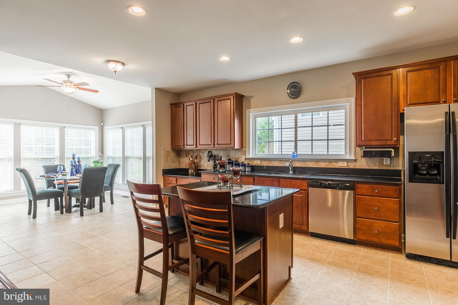 4157 Agency Loop Triangle, VA 22172 - Photo 3 of 30 a large kitchen with a table and chairs