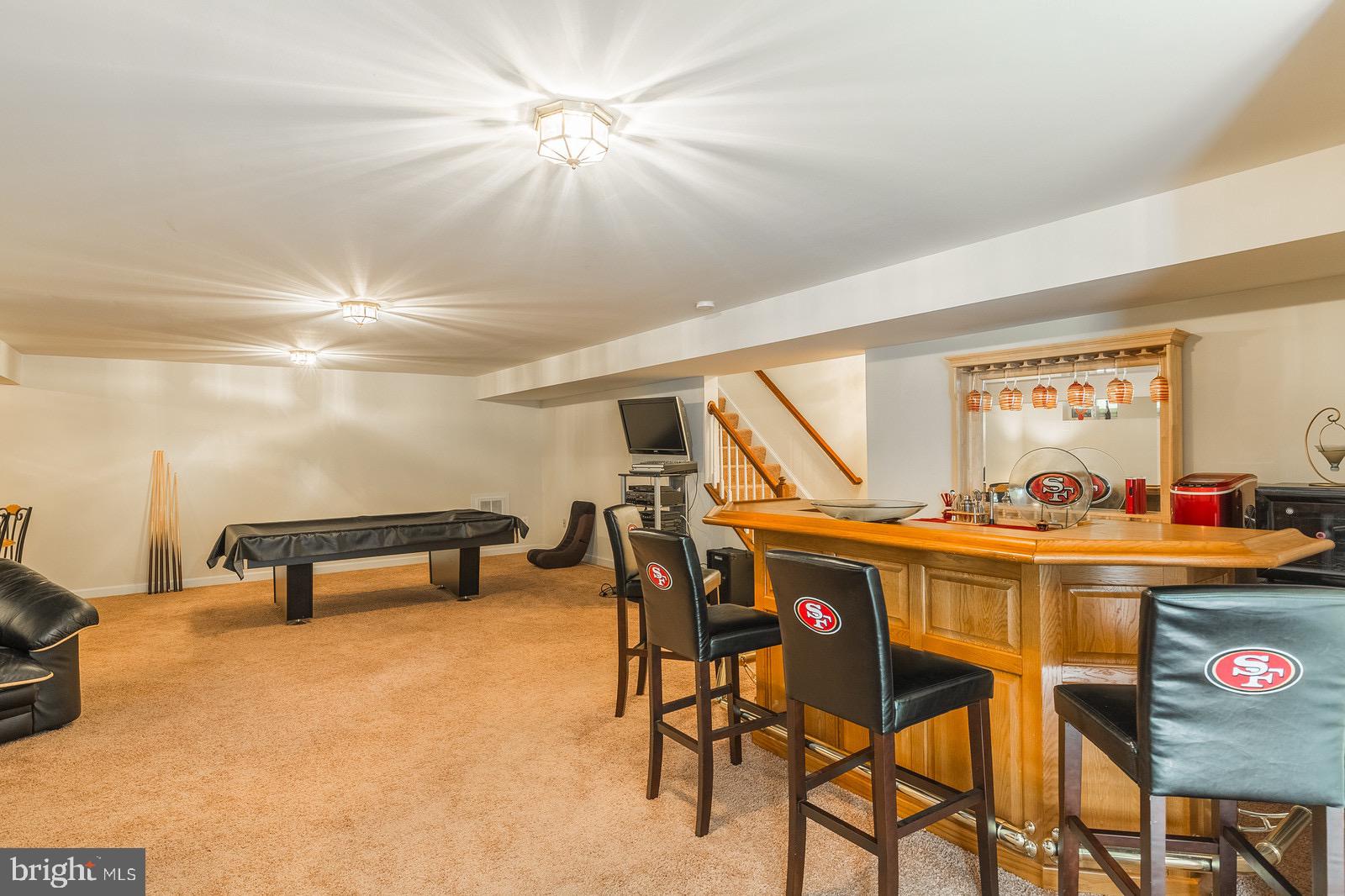 4157 Agency Loop Triangle, VA 22172 - Photo 27 of 30 a view of a dining room with furniture and a chandelier