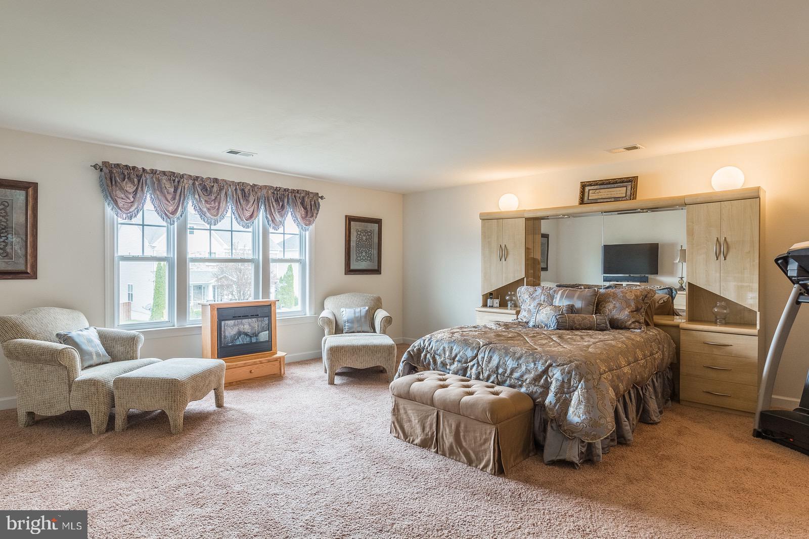 4157 Agency Loop Triangle, VA 22172 - Photo 6 of 30 a bedroom with furniture and a large window