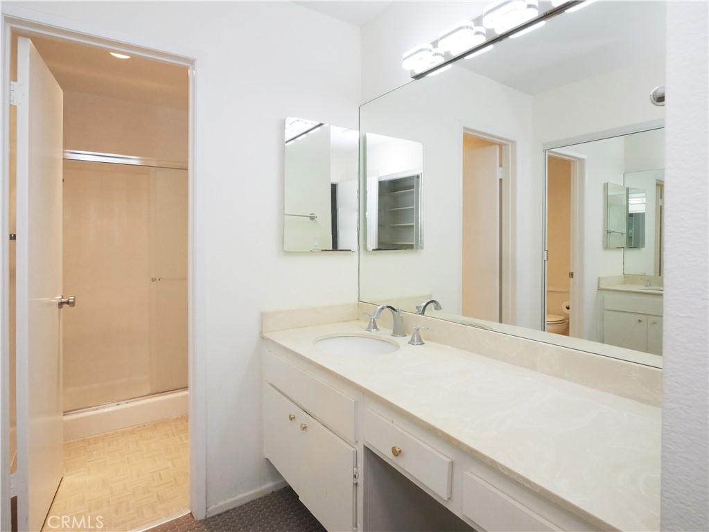 28121 Highridge Road, Unit 311 Rancho Palos Verdes, CA 90275 - Photo 13 of 25 a bathroom with a sink and a mirror