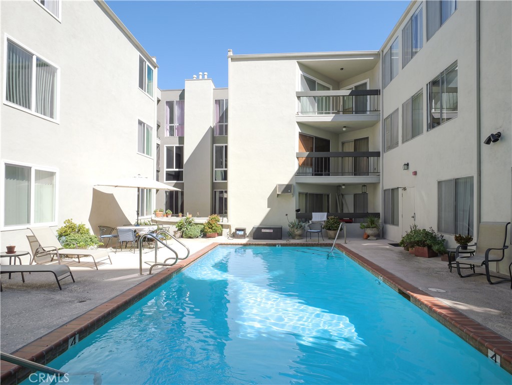 28121 Highridge Road, Unit 311 Rancho Palos Verdes, CA 90275 - Photo 16 of 25 a view of a swimming pool with outdoor seating