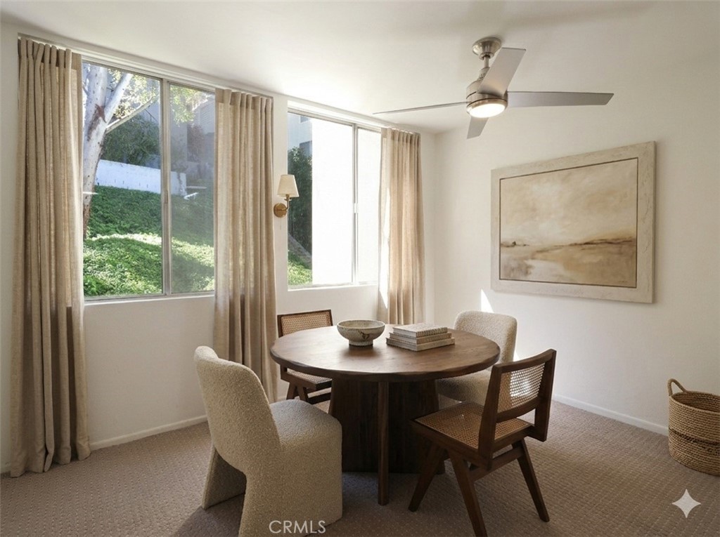 28121 Highridge Road, Unit 311 Rancho Palos Verdes, CA 90275 - Photo 4 of 25 a dining room with furniture window and wooden floor