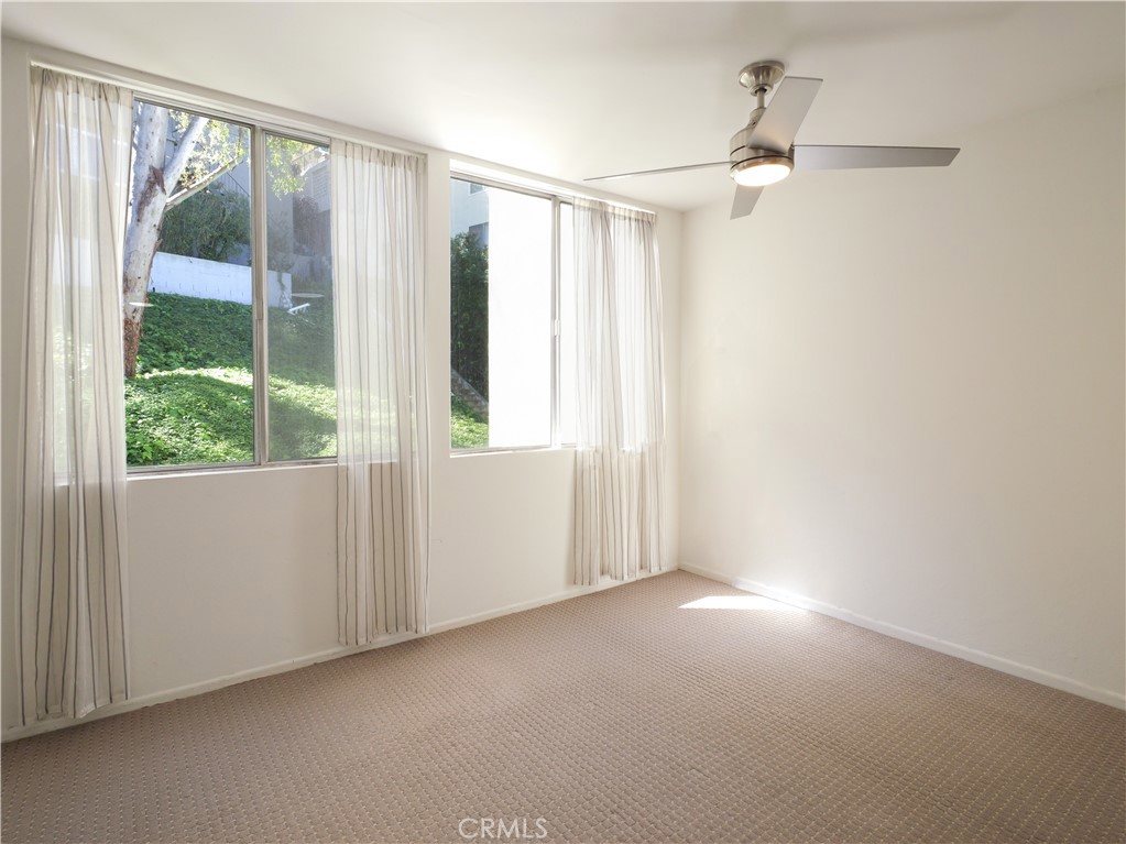 28121 Highridge Road, Unit 311 Rancho Palos Verdes, CA 90275 - Photo 5 of 25 a view of empty room with window and ceiling fan