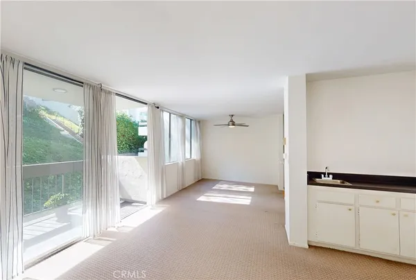 a view of an empty room with a window