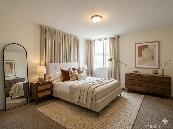 a bedroom with a bed and a dresser