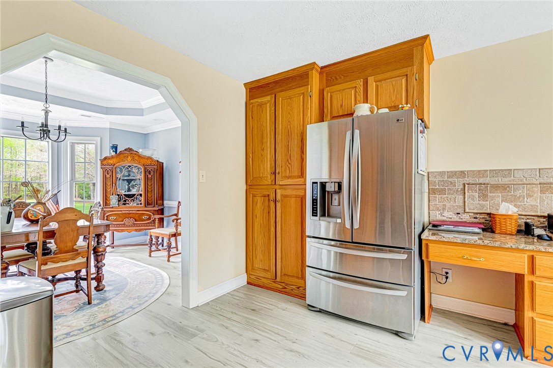 5629 West Quaker Road Disputanta, VA 23842 - Photo 11 of 43 Kitchen with a notable chandelier, ornamental mold