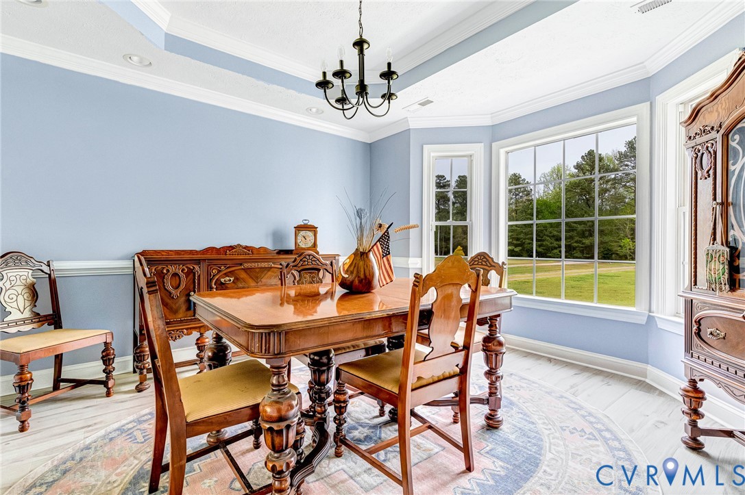 5629 West Quaker Road Disputanta, VA 23842 - Photo 14 of 43 DDining Room with Tray Ceiling, a chandelier, ligh