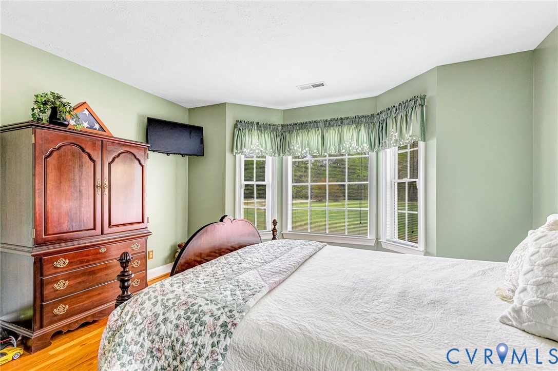 5629 West Quaker Road Disputanta, VA 23842 - Photo 22 of 43 2nd Bedroom Hardwood floors, Bay Window